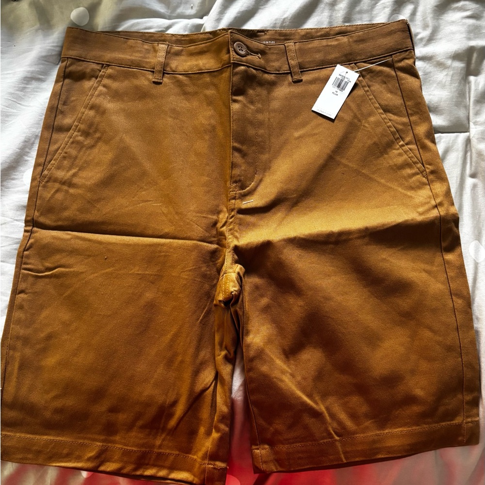 4 pairs of boys shorts from Old Navy size 14 plus. 3 new w/ tags 1 gently worn.